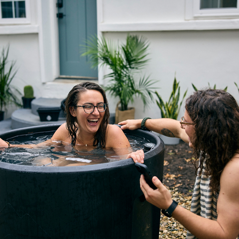 Couple talking while woman smiling in Ice Barrel 300