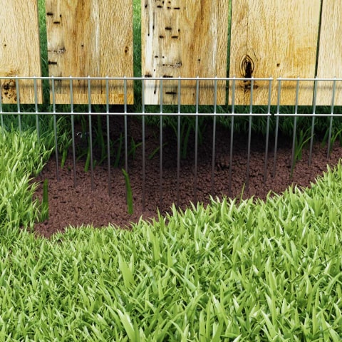 Dog keeps digging holes under cheap fence