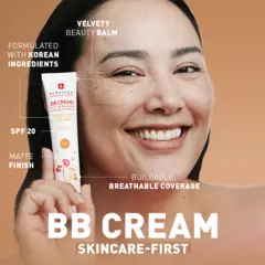 Smiling woman holding BB Cream tube