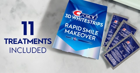 11 Treatments Included. Pack of Crest 3DWhitestrips Rapid Smile Makeover next to 3 sachets on a marble counter.