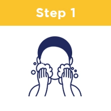 Step One: A person massaging their face with foamy suds
