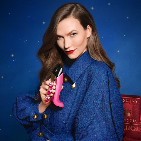 Karli Kloss model holding good girl blush collector bottle