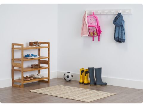 two stacked bamboo shoe rack at an entry way of a house