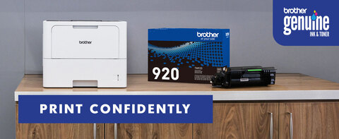 Print Confidently with Brother Genuine Ink &amp; Toner. Brother business monochrome laser printer on corporate office desk with Brother Genuine TN920 replacement toner