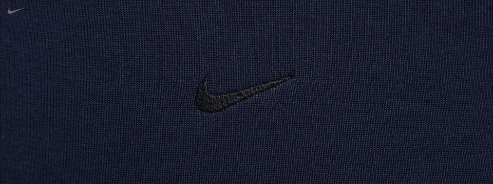 Embroidered Nike logo on smooth, premium fabric for a sleek, refined look.