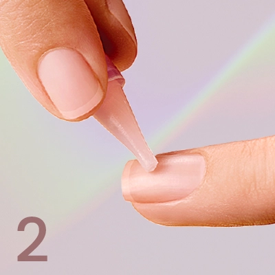2. Apply glue to natural nail.