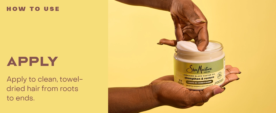 Image of hands taking leave-in conditioner from pot.