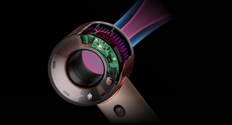 Cutaway showing the technology within and airflow through the Dyson Supersonic Travel hair dryer.