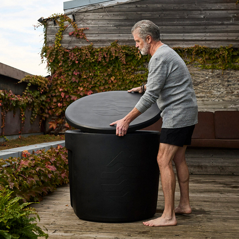 Man removing lid from Ice Barrel 300