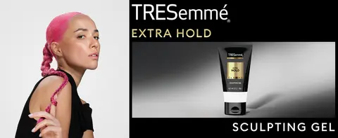 Model with pink braided hair next to a TRESemmé gel tube on a sleek gray gradient background.