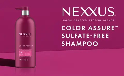 Image of Nexxus shampoo bottle with pump against magenta background with the headline: Nexxus Salon Crafted Protein Blends Color Assure Sulfate-Free Shampoo.