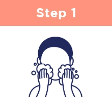 Step One: A person massaging their face with foamy suds