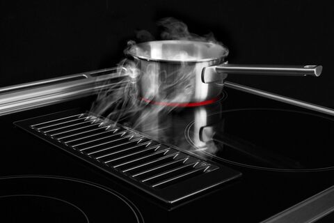 Downdraft slide in store electric range