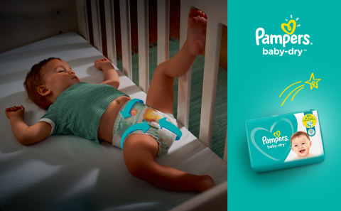 Baby peacefully sleeping wearing Pampers baby-dry