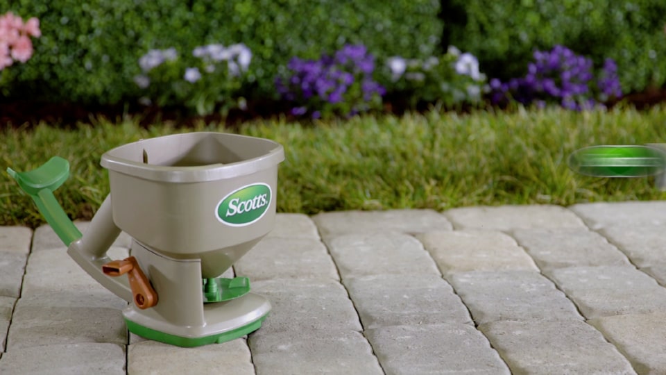 thumbnail video image 2 of Scotts Whirl Hand-Powered Spreader for Grass Seed, Fertilizer, Salt and Ice Melt, 2 of 11