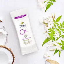 Dove Aluminum Free Coconut &amp; Pink Jasmine deodorant on a light background with florals and coconut.