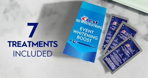 7 Treatments Included. Pack of Crest 3DWhitestrips Event Whitening Boost next to 3 sachets on a marble counter.