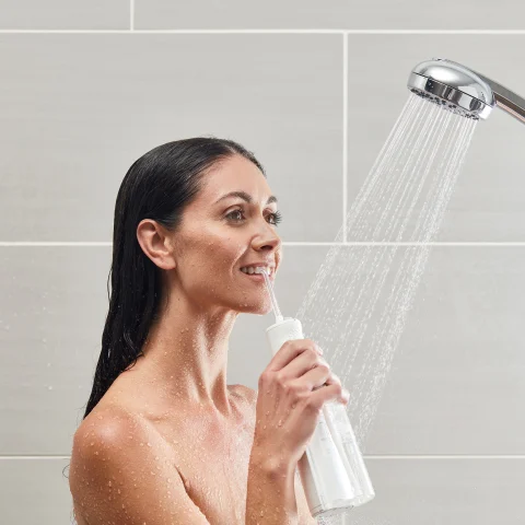 Using the White Cordless Express Water Flosser WF-02 in Shower