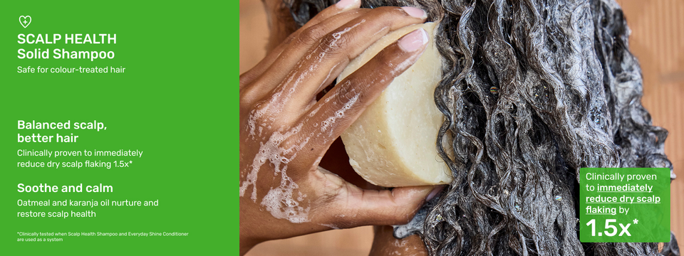 Image of Ethique Beauty&#39;s Scalp Health Solid Shampoo in use with lots of lather.