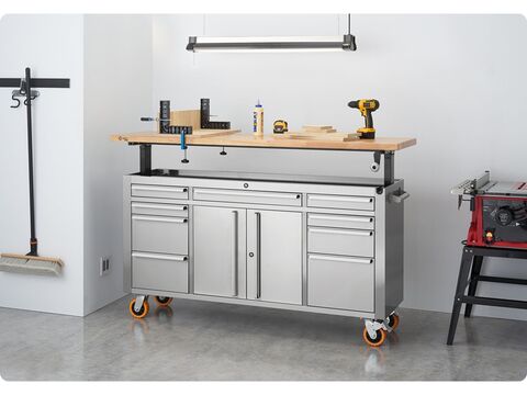 workbench with the wood top raised, in a home garage used as a wood working surface