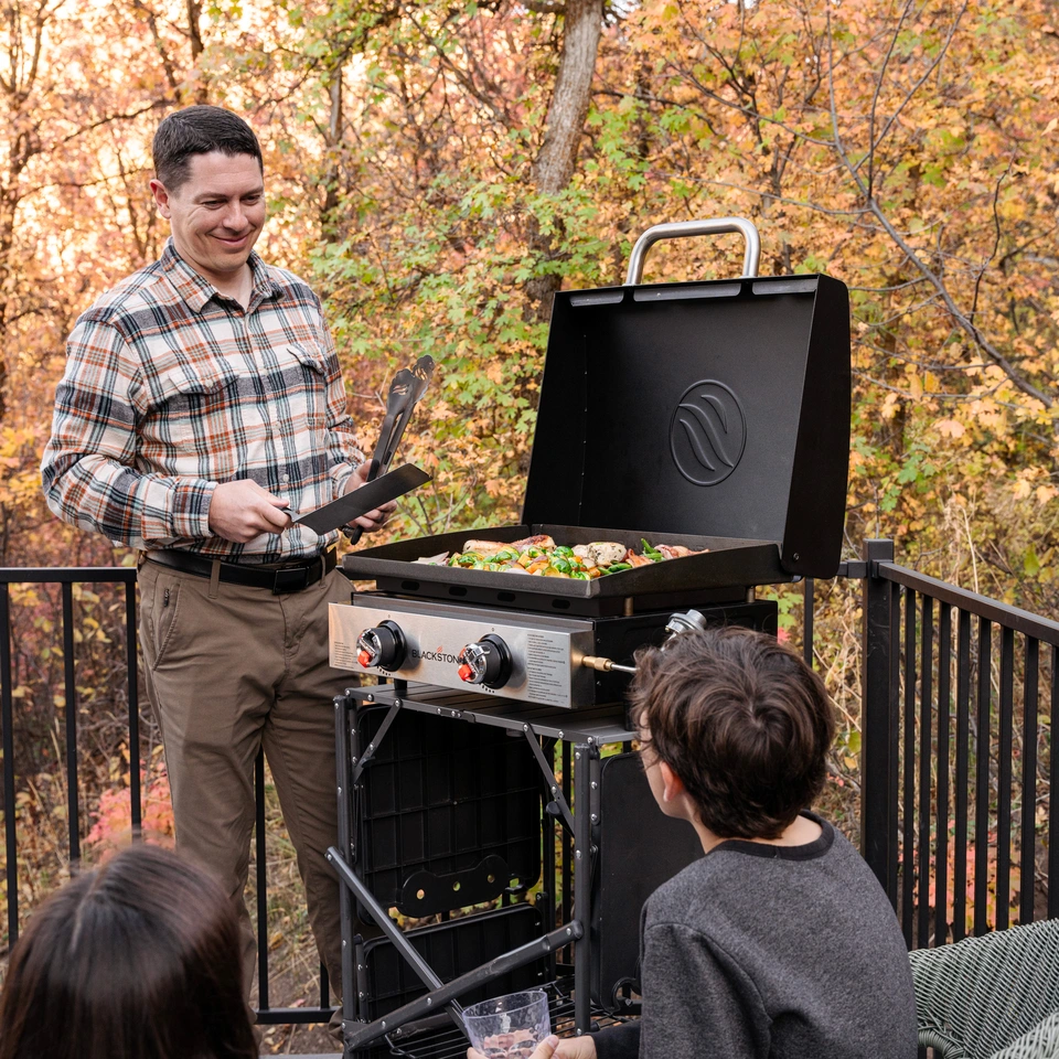 A small family cooking on a 22 inch tabletop griddle