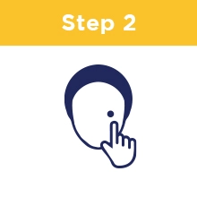 Step Two: A person applying a circular patch to their face