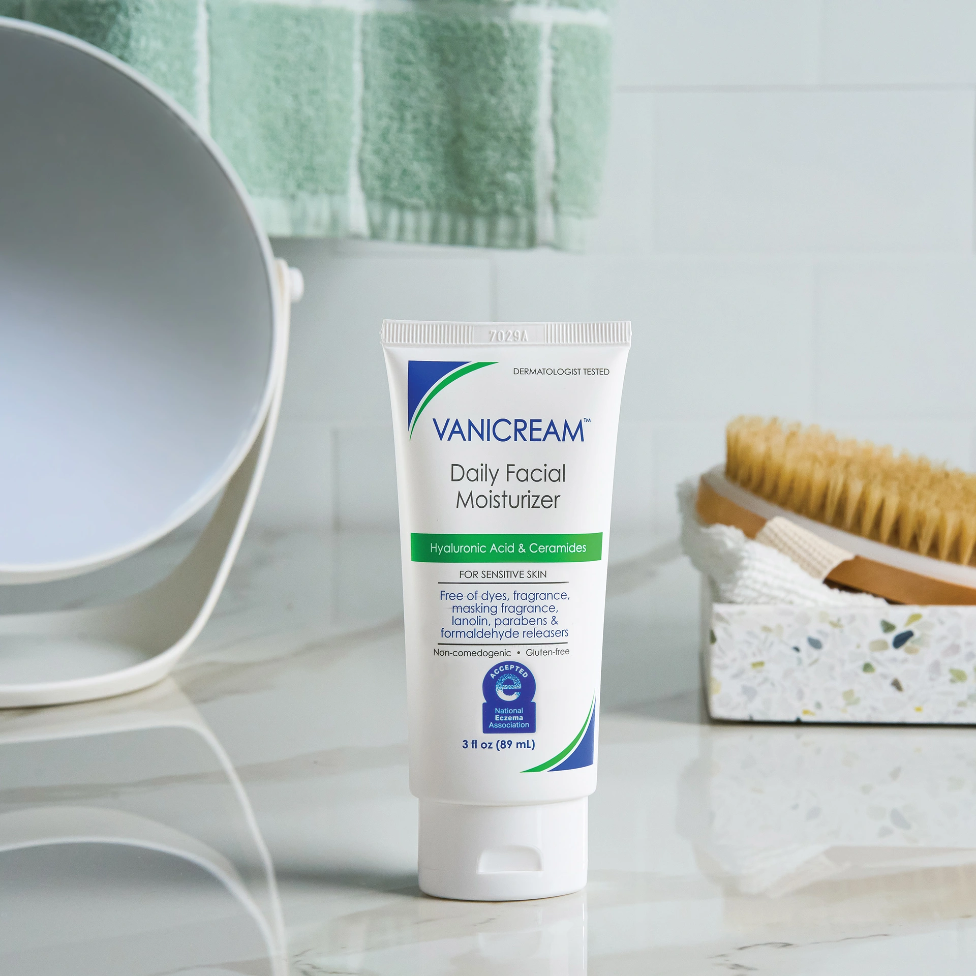 A tube of vanicream daily facial moisturizer sits on a bathroom counter.