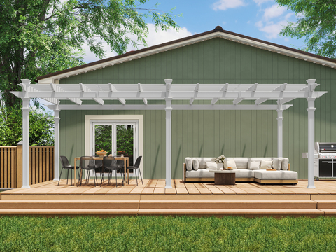 A seating area on a wooden deck underneath a white pergola