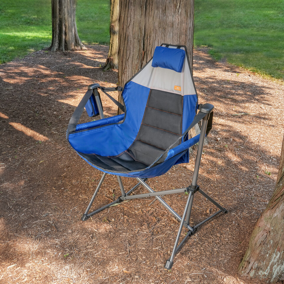 Swing chair in lightly wooded area.