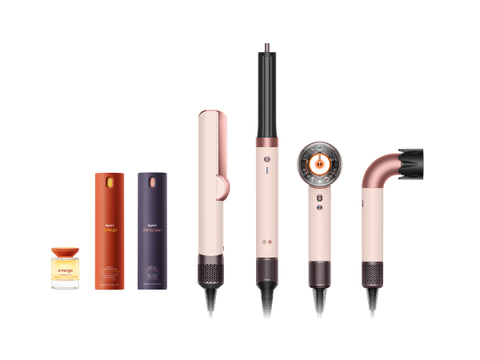 Dyson nourishing and styling beauty collection products in a row next to Dyson styling machines