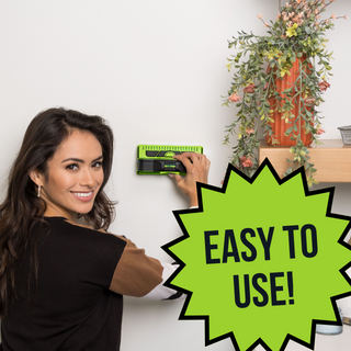 Woman smiling at camera with 7000+ stud finder and flowers