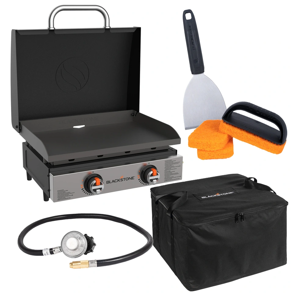 An image displaying all of the contents of the griddle bundle offered. It contains the 22 inch omnivore griddle with hood, a 3 foot bulk propane tank adapter hose, a griddle scraper, three scrub pads, a scrub pad handle, and a carry bag for the griddle