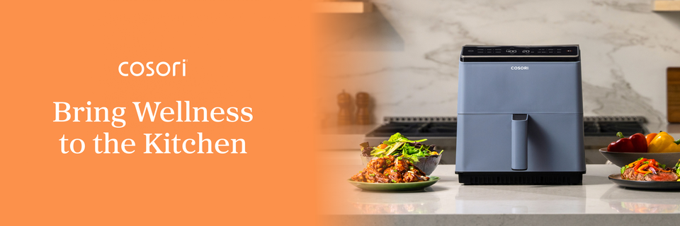 On a banner, text beside an image of a mostly blue, boxy air fryer on a counter amid various foods reads, “Cosori. Bring Wellness to the Kitchen.”
