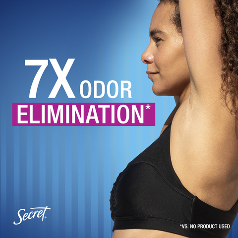 A confident woman with her arms up showing her bare underarms. Tagline: 7 times odor elimination.