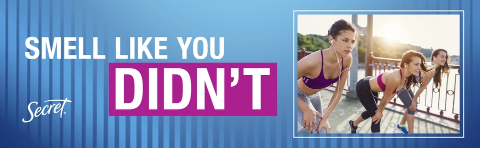 Three women crouched, ready to begin a run. The Secret logo. Tagline: Smell like you didn't.