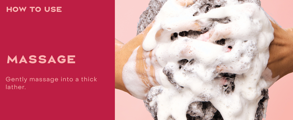 Close up shot of woman's hands massaging heir covered in foam, next to massaging instructions.