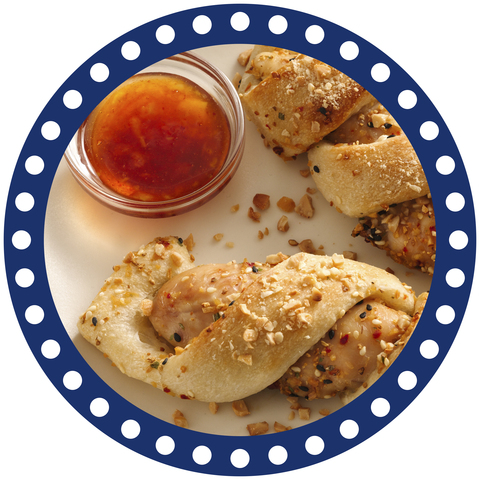Use Pillsbury Original Breadsticks to create Cashew Chicken Twists with Spicy Orange Sauce