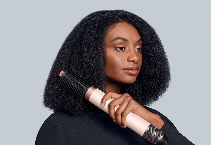 Model using Dyson Airwrap Co-anda2x with the Tension comb 2x attachment