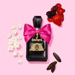 Viva La Juicy Elixir perfume bottle with berries, flower petals and tonka bean