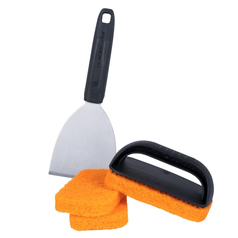 Griddle scraper, scrub pad handle, and three scrub pads shown