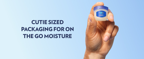 Hand holding a small pot of Vaseline Lip Therapy Jelly, next to text about on-the-go benefits.