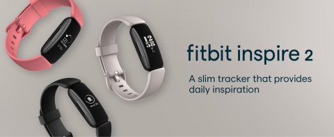 Fitbit Inspire 2 Trackers In Various Colors On A Tan Gradient Background
