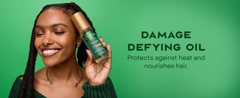 Image of a black woman with braided hair, next to text about damage defying oil.