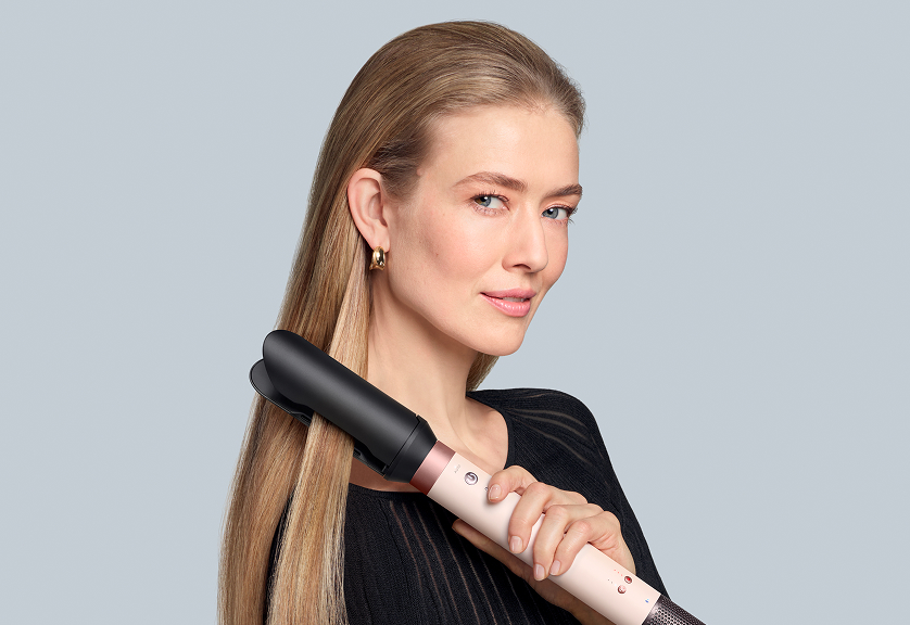 Model using Dyson Airwrap Co-anda2x with the Airsmooth2x attachment