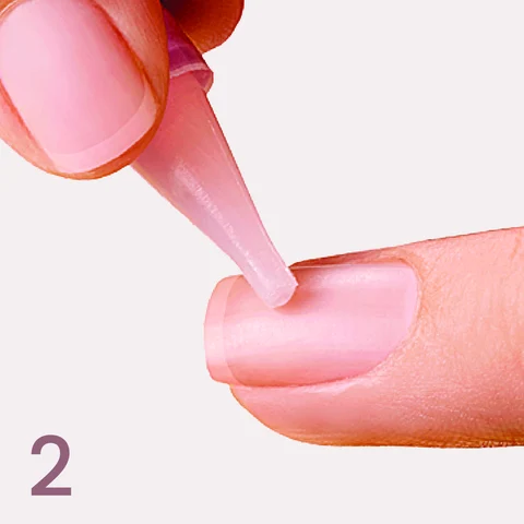 2. Apply glue to natural nail.