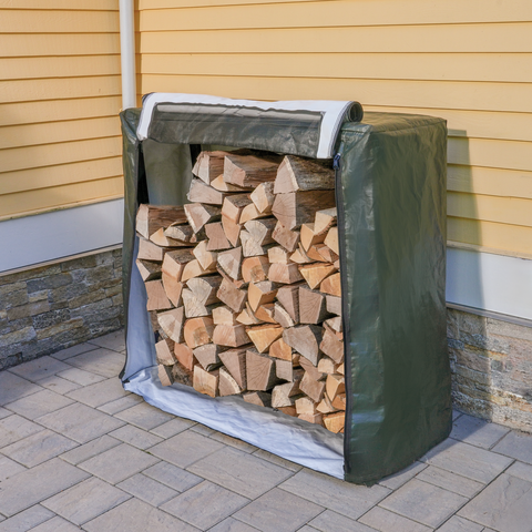 firewood rack full of wood with cover front zippered open.