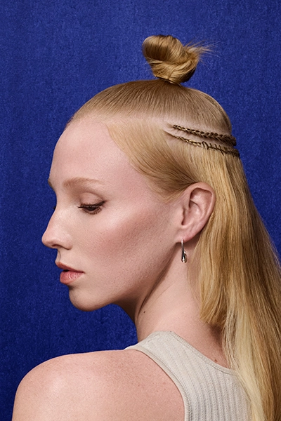 Woman with extensions looks to the side