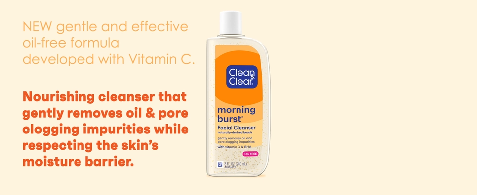 Bottle of Clean &amp; Clear Morning Burst Facial Cleanser on orange background