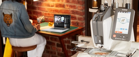 Woman sitting & watching turtorials on a laptop