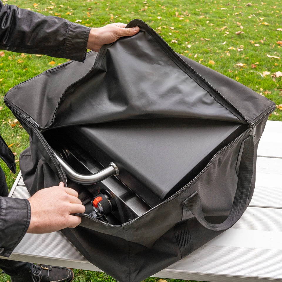 Carry bag shown partway unzipped to display the griddle housed inside